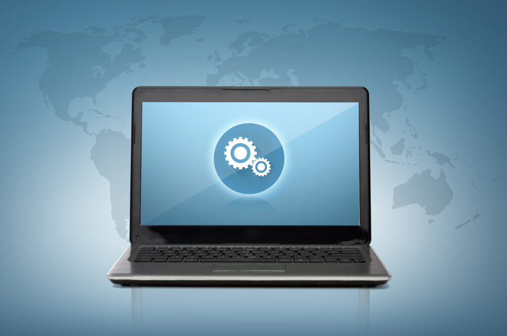 Concept image of a laptop displaying digital advertising graphics, surrounded by holographic technology icons, representing the intersection of technology and advertising in 2025.